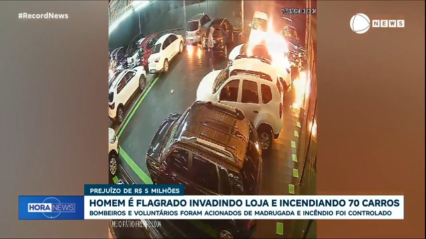 Vídeo: Homem encapuzado é flagrado invadindo loja e incendiando 70 carros, em Joinville (SC)