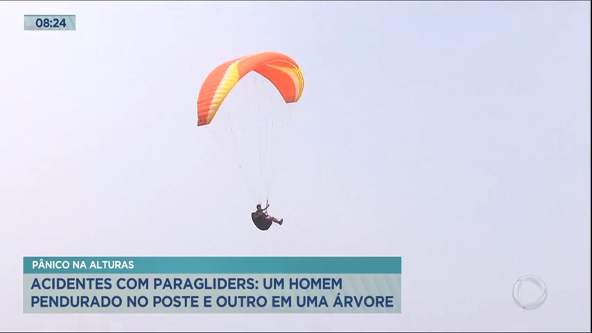 Vídeo: Piloto de paraglider fica pendurado em poste de iluminação em acidente no litoral paulista